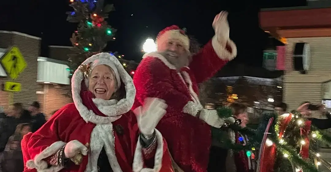 Holiday Fun for All in Cayuga County Santa riding his sleigh in the holiday parade.