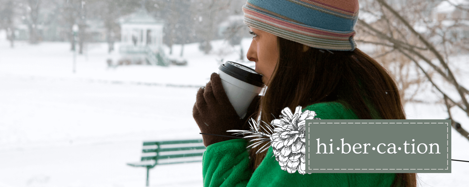 Plan Your Perfect Hibercation in Cayuga County -2024 women in winter clothing drinking a hot beverage