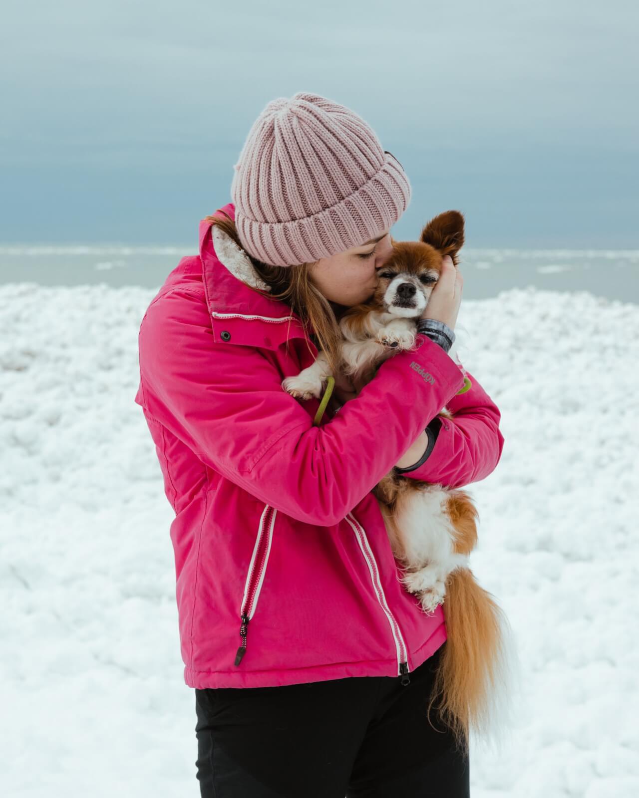 GIRL WITH DOG IN THE WINTER