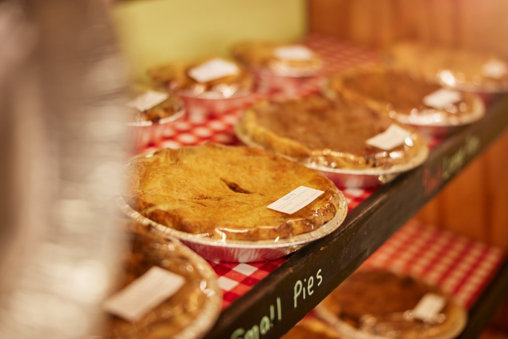 Sweet Treat Trail 2025: Locally Grown=Sustainable & Fresh Fresh baked apple pies lining a shelf