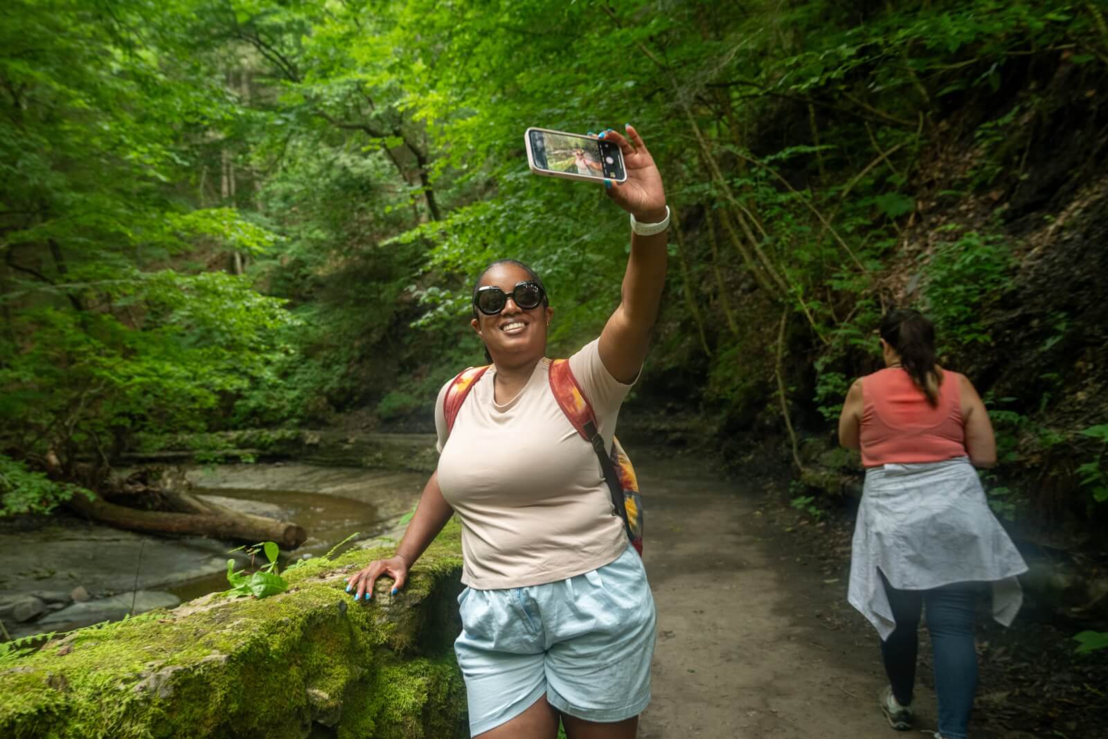Plan Your Vacation: Experiences For Every Kind Of Traveler Experience the outdoors in Cayuga County -two women taking a selfie at Fillmore Glen State Park