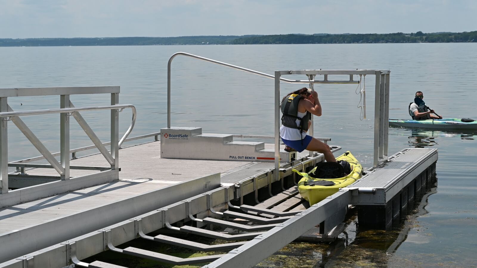 Celebrating Disability Pride Month: Building a More Inclusive Cayuga County Disability Accessible boat launch with two kayakers