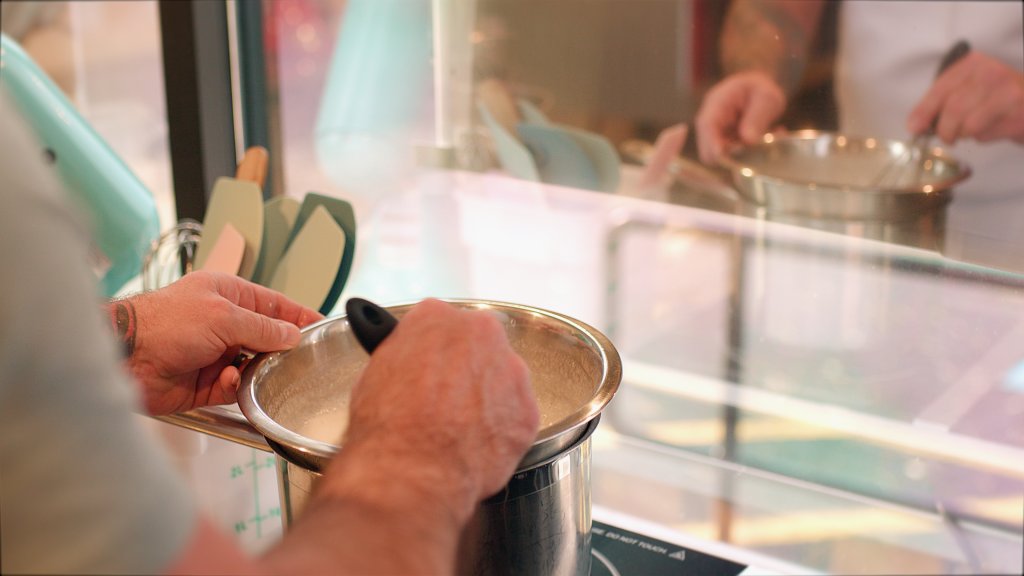 Baker mixing batter in a bowl, part of our Cayuga Cuisine Series