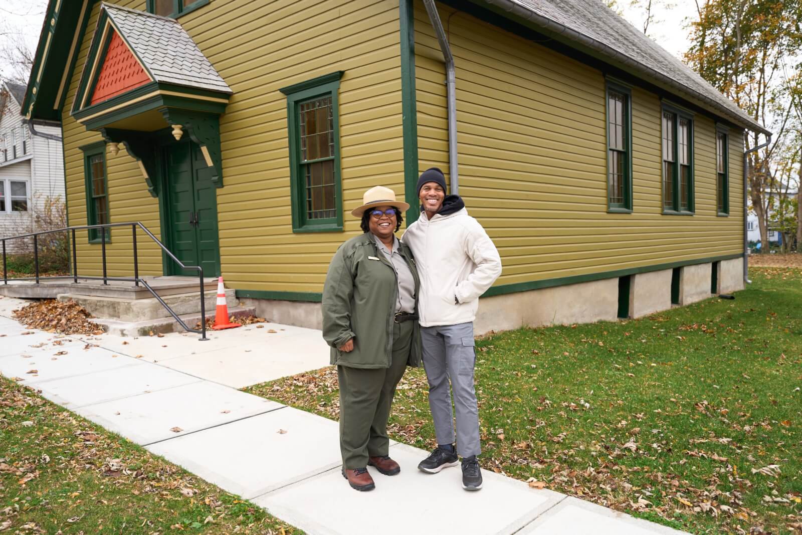 Ranger Brittany and visitor standing in front of the AME Zion Church, the church that Harriet Tubman attended and where her funeral was held