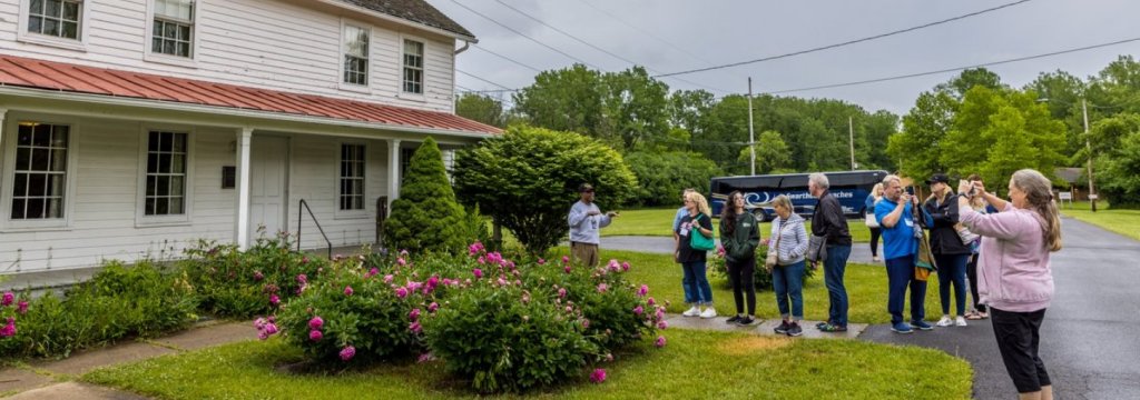 #LiveLikeHarriet: Summertime in Harriet Tubman’s Chosen Hometown A group of people stand on the walkway of a Harriet Tubman site.