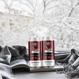 two cans of beer with HIbercation buffalo check design
