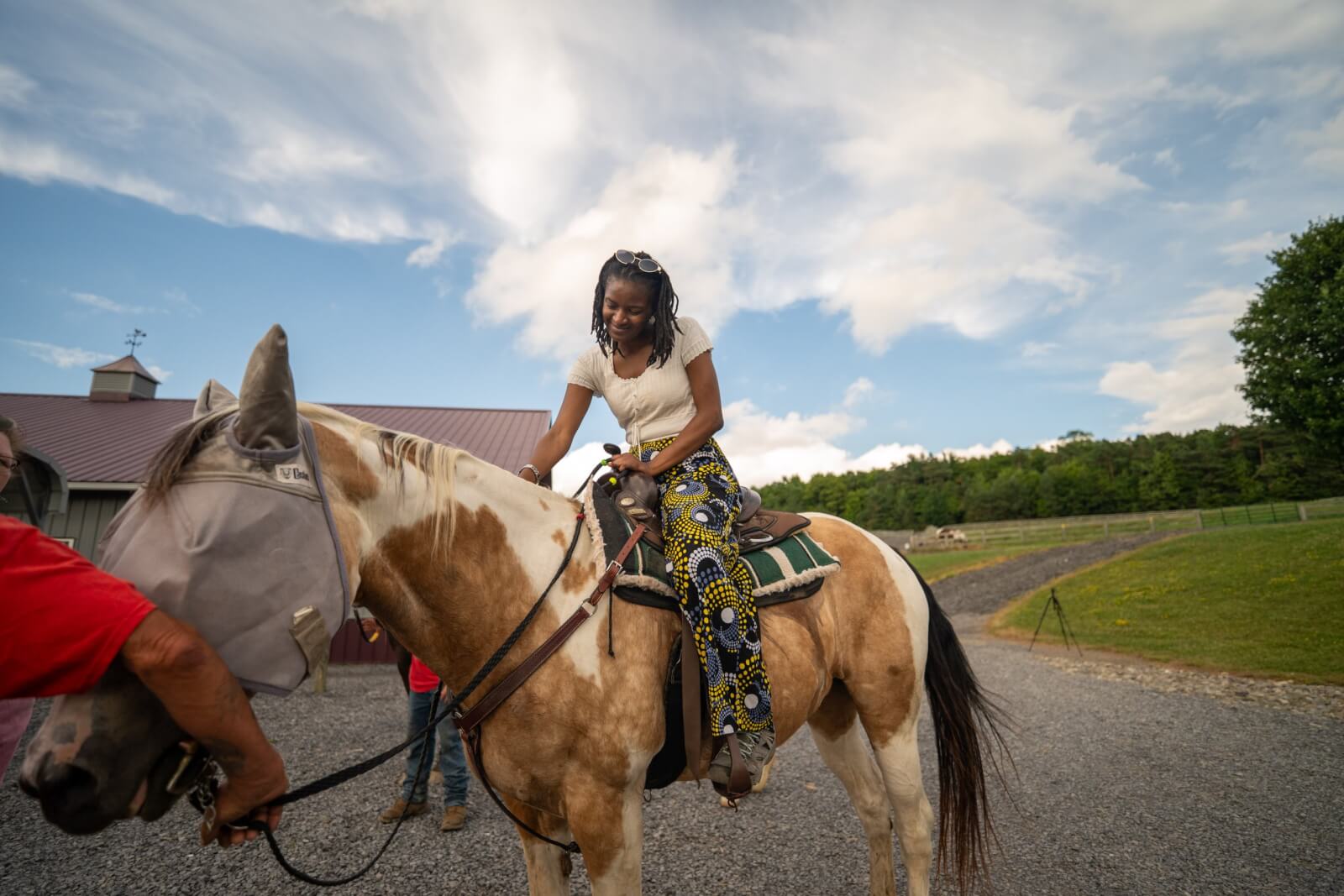 Women  on a light brown horse