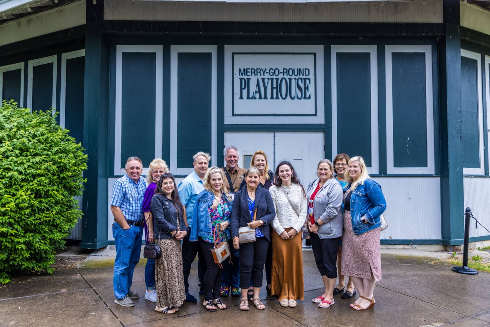 Group gathered in front of the Merry-Go-Round Playhouse that houses the REV Theatre Company.
