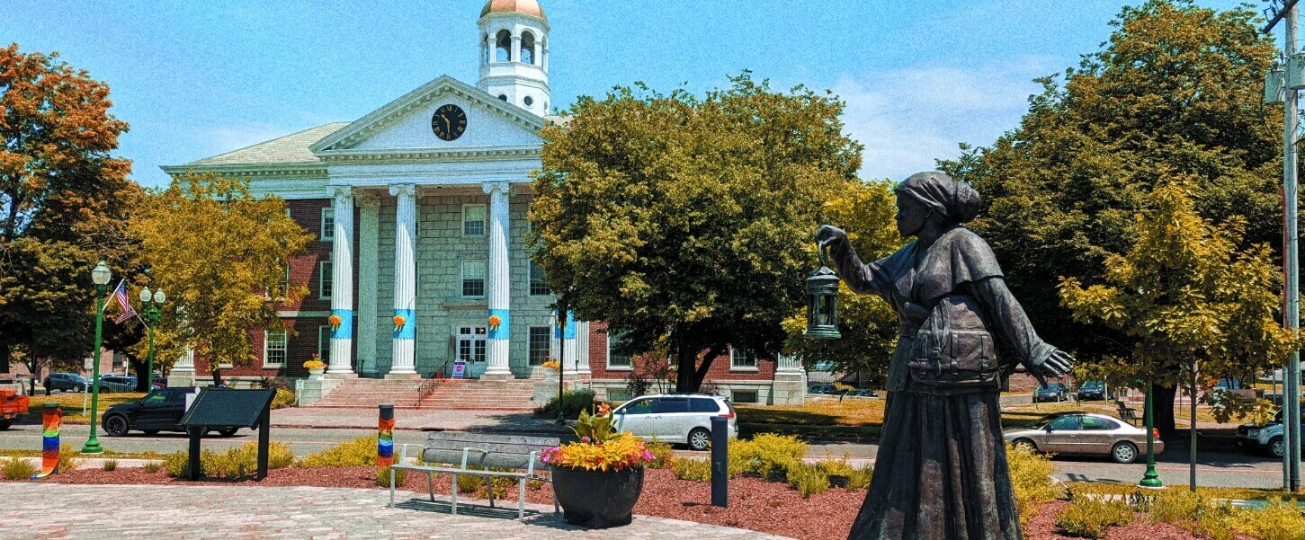 A bronze statue of Harriet Tubman stands outside the NYS Equal Rights Heritage Center.