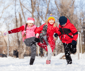 Holiday Break Fun: 10 Ways to Keep Kids Busy in Cayuga County Three kids walking in the snow